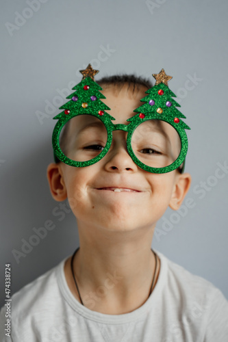 portrait of a boy wearing a santa hat