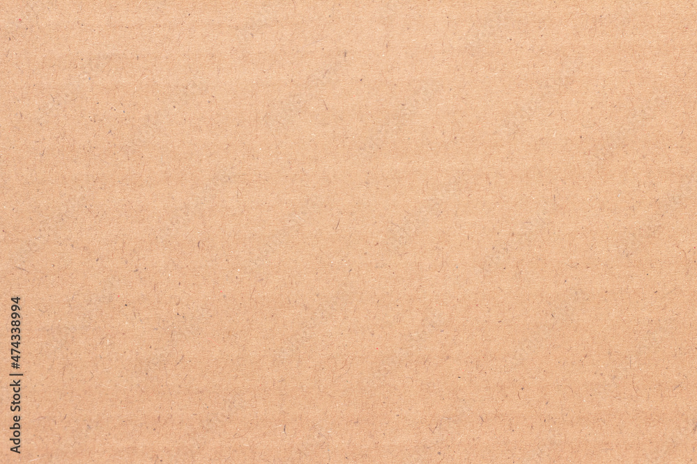 A sheet of brown cardboard. Paper natural texture. A sheet of brown cardboard. Paper natural texture.
