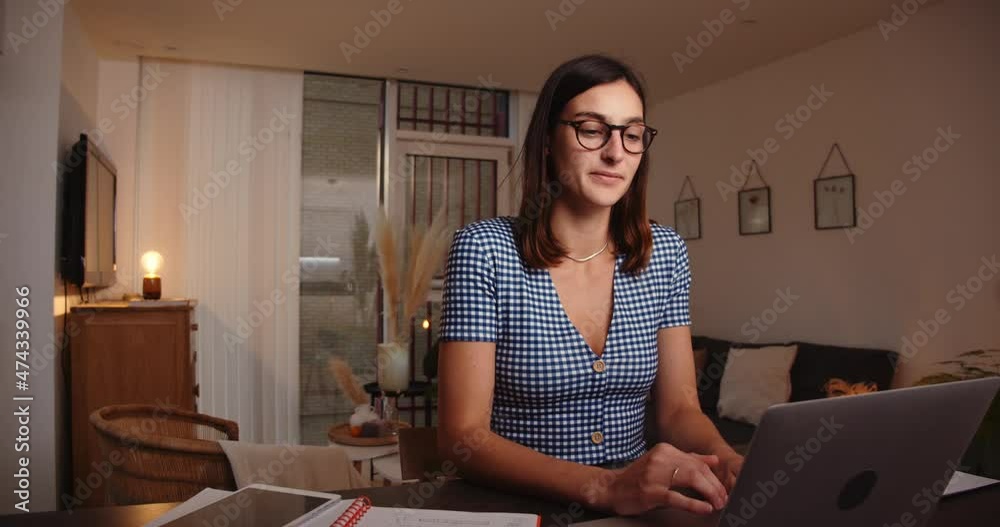 Caucasian female business woman working from home typing on laptop finishing assignments Caucasian female business woman working from home typing on laptop finishing assignments