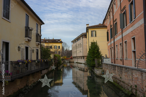 View of the canal and the historic buildings of the city. Treviso, Italy.