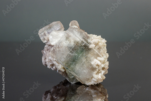 macro mineral stone Apophyllite stilbite on a gray background photo