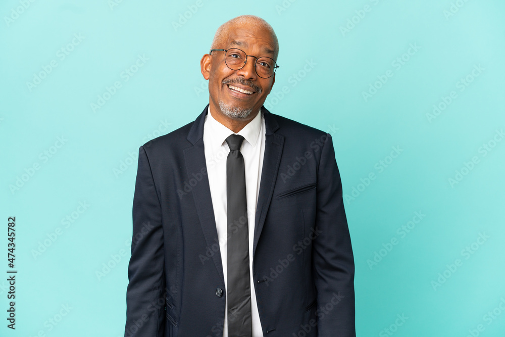 Business senior man isolated on blue background with surprise facial expression Business senior man isolated on blue background with surprise facial expression