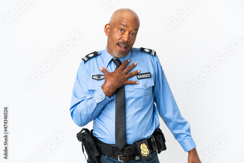 Young police man isolated on white background surprised and shocked while looking right