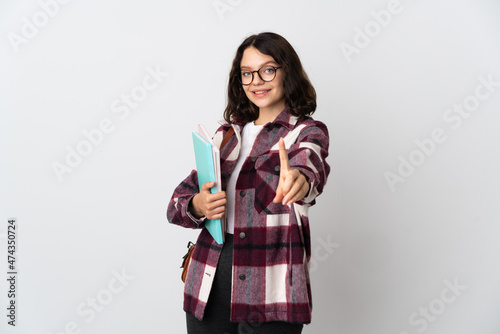 Teenager Ukrainian student isolated on white background showing and lifting a finger