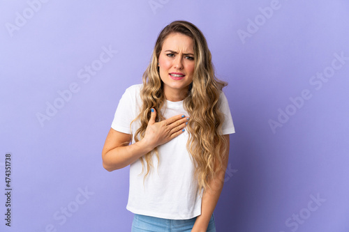 Young Brazilian woman isolated on purple background pointing to oneself
