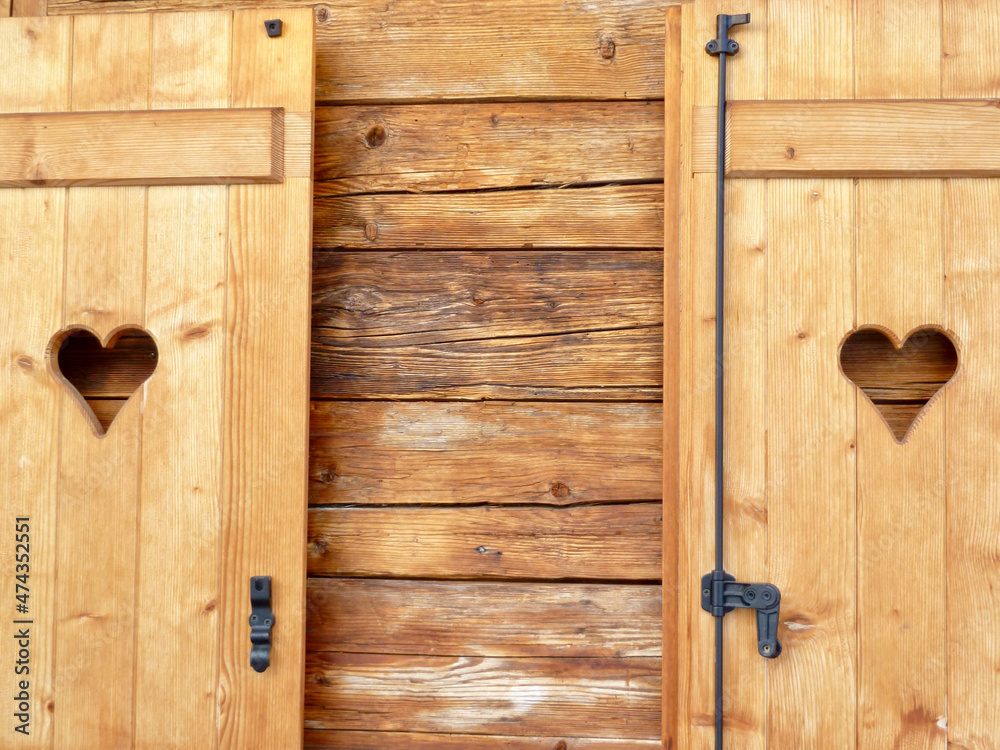 Wooden shutters with hearts. Austria. Wooden shutters with hearts. Austria.