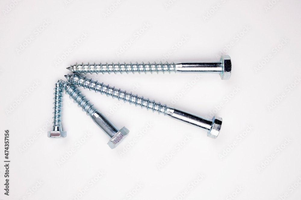 Small self-tapping screws on a white background in the center. Self-tapping frame. Small self-tapping screws on a white background in the center. Self-tapping frame.