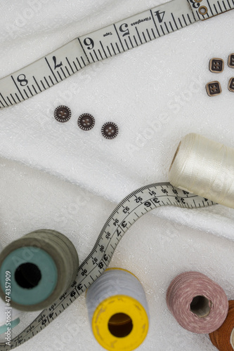 Stitching Material, Measurement Type, Thread Coan, Buttons.   photo