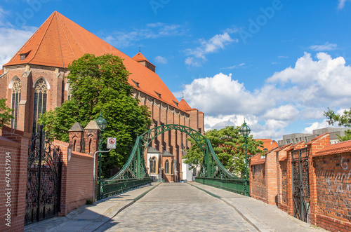 Wroclaw, Poland - crossed by the Oder River, Wroclaw displays a large number of colorful bridges, which are a main landmark of the town. Here in particular a typical iron bridge