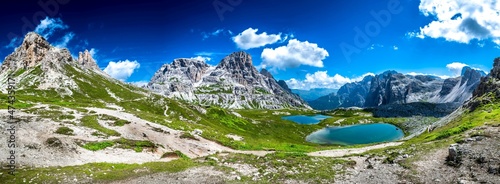 Alpine Landscape With Mountain Peaks And Clear Lakes At The Formation Tre Cime Di Lavaredo In The Dolomites Of South Tyrol In Italy photo