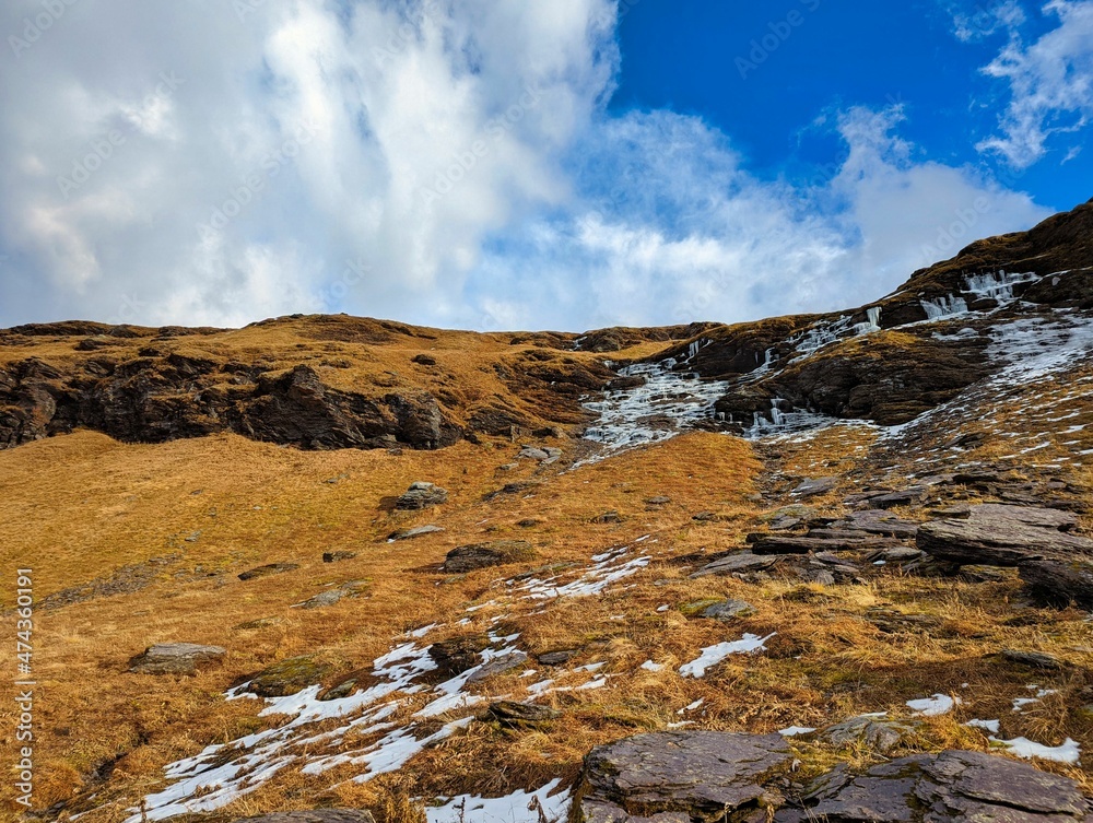 beautiful autumn hike in the beautiful swiss mountains Panorama picture with the first snow.Mountain peaks full of snow