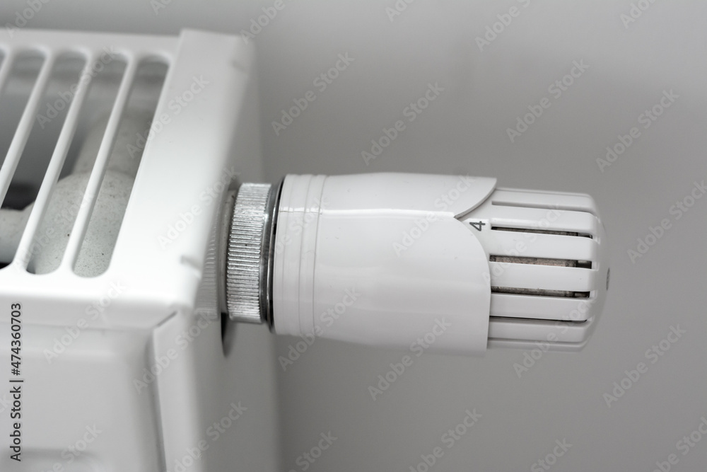 Heating radiator with temperature knob, regulator closeup Heating radiator with temperature knob, regulator closeup