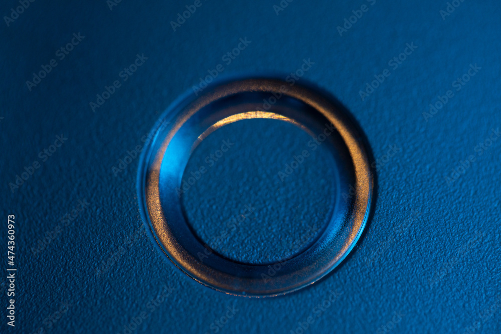Top view of the drone body, the power button with a charge indicator, the battery is inserted into the quadcopter,the battery is discharged.In blue, close-up. Top view of the drone body, the power button with a charge indicator, the battery is inserted into the quadcopter,the battery is discharged.In blue, close-up.