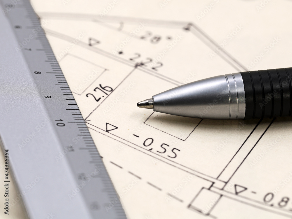 architecture plan of a house with pen and ruler, close up architecture plan of a house with pen and ruler, close up