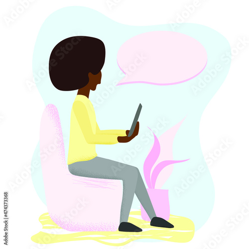 Young woman sitting in the chair with the tablet or smartphone in her hands. Online education, work and social networks concept