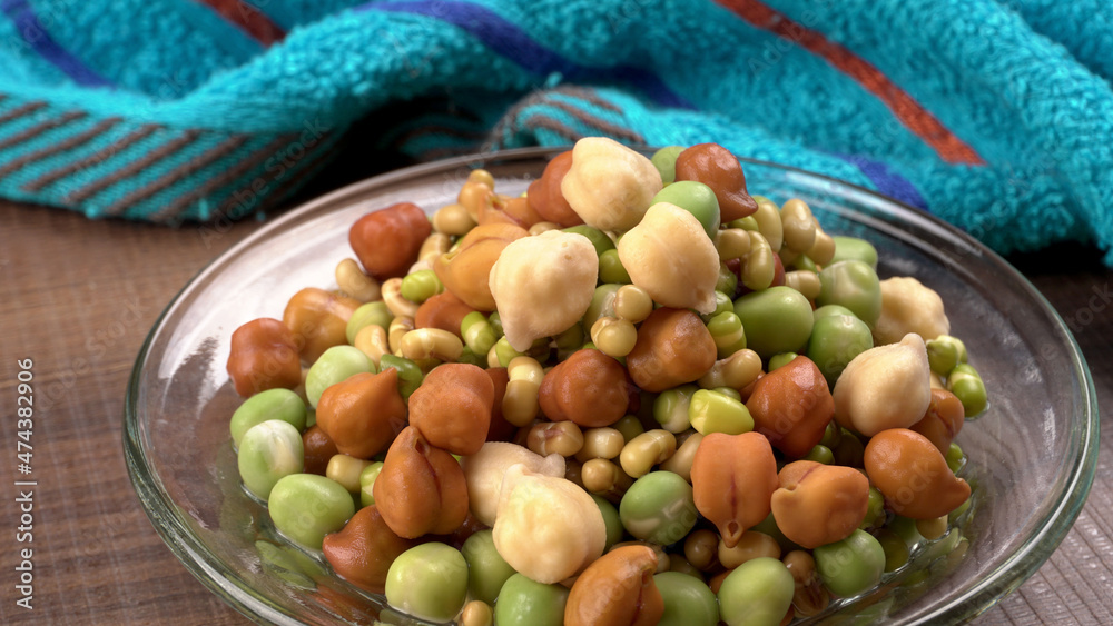 Healthy diet and vegetarian food. Mix of fresh sprouts on beautiful background. macrobiotic food. Sprouted wheat, peas, lentil seeds. Copy space Healthy diet and vegetarian food. Mix of fresh sprouts on beautiful background. macrobiotic food. Sprouted wheat, peas, lentil seeds. Copy space