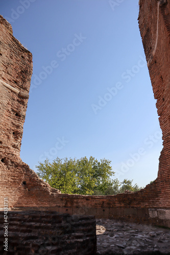 hole in the red brick wall of ancient Red Basilica (Kızıl Avlu) in Bergama, Turkey photo