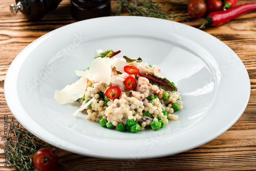 italian risotto with shrimps on white plate
