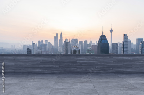 Photography Panoramic Kuala Lumpur skyline view, concrete observatory deck on rooftop, sunset