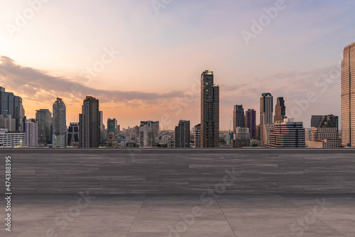 Panoramic Bangkok skyline view, concrete observatory deck on rooftop, sunset. Luxury Asian corporate and residential lifestyle. Financial city downtown, real estate. Product display mockup empty roof