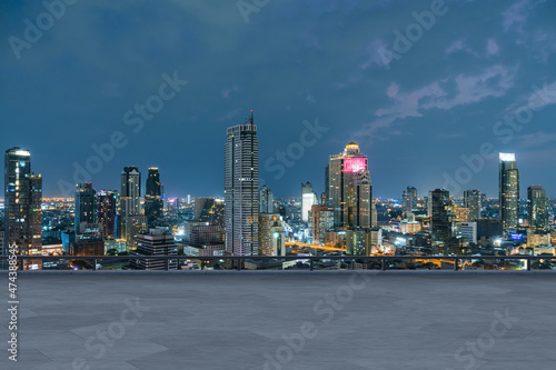 Panoramic Bangkok skyline view, concrete observatory deck on rooftop, night time. Asian corporate and residential lifestyle. Financial city downtown, real estate. Product display mockup empty roof © VideoFlow