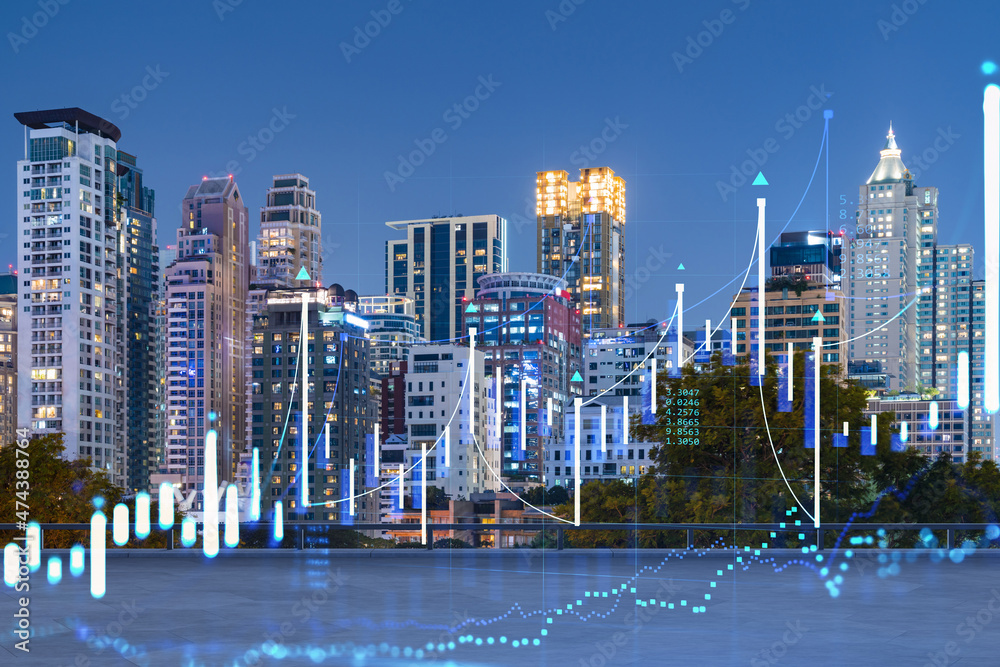 Fototapeta premium Rooftop with concrete terrace, Bangkok night skyline. Forecasting and business modeling of financial markets hologram digital charts. City downtown. Double exposure.