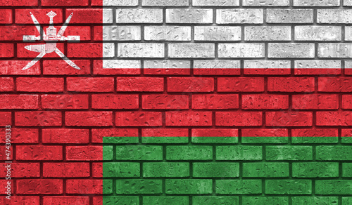 Oman flag on a brick wall
