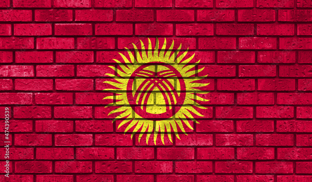 Kyrgyzstan flag on a brick wall Kyrgyzstan flag on a brick wall