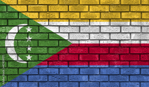 Comoros flag on a brick wall