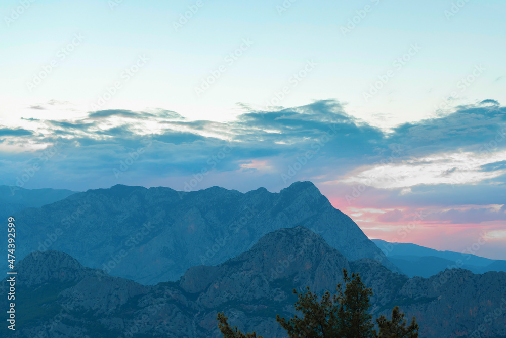 Beautiful blue high mountains at sunset. Beauty of nature concept