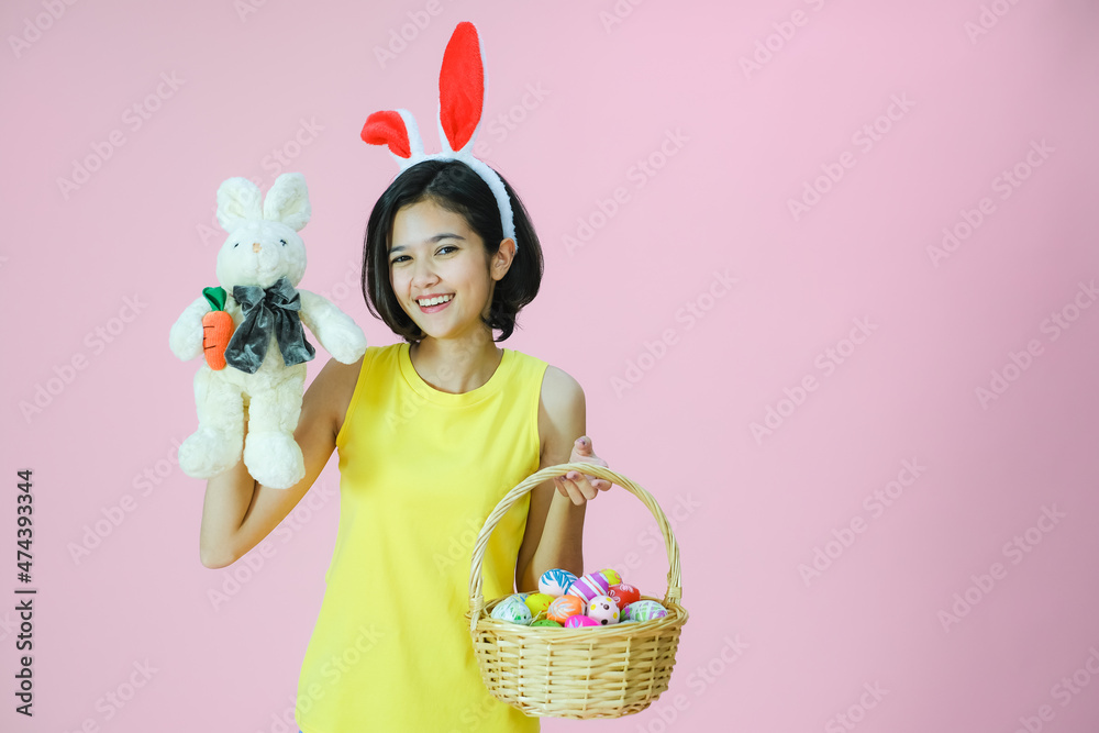 Portrait beautiful young asia girl with painted eggs, Happy easter day