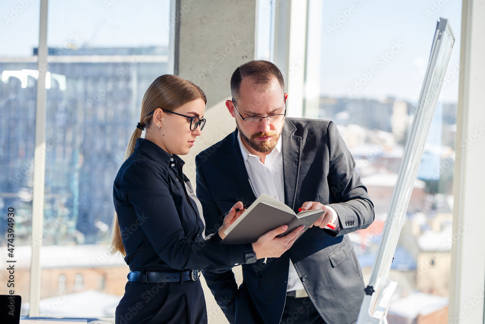 Business people meet in the office and discuss joint business projects. Business partnership concept. Business people meet in the office and discuss joint business projects. Business partnership concept.