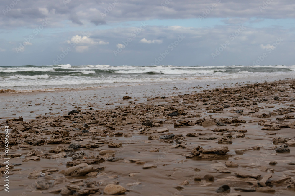 Flat stones on a beach horizontal Flat stones on a beach horizontal