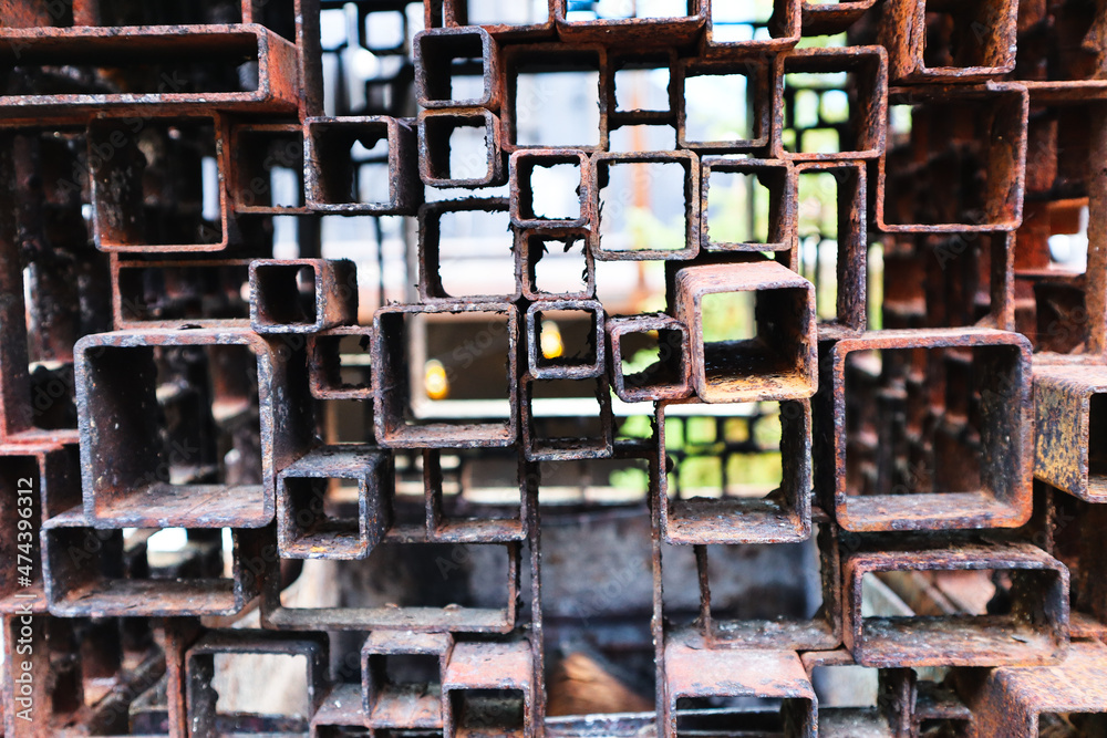small and big rusty metal squares welded together