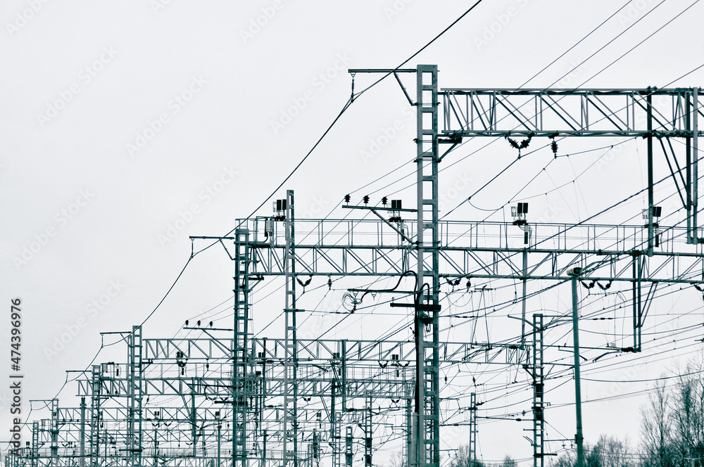 Railway station, overhead supports power lines, energy industry. Trusses from high voltage wires Railway station, overhead supports power lines, energy industry. Trusses from high voltage wires
