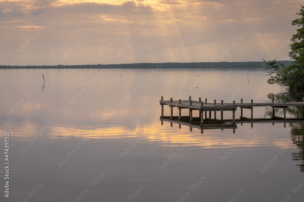 A jetty at the shore of the bathing island in Steinhude with view at the Steinhuder, Lower Saxony, Germany A jetty at the shore of the bathing island in Steinhude with view at the Steinhuder, Lower Saxony, Germany