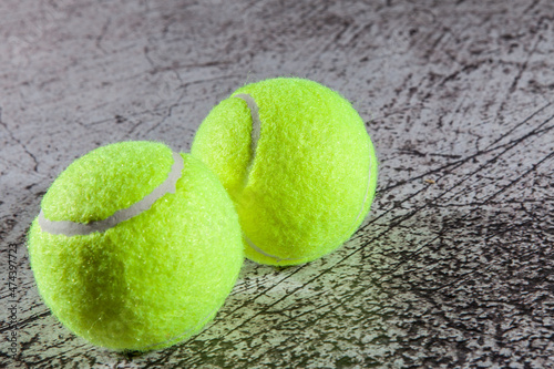 Close up of tennis balls on asphalt tennis court © azyryanov