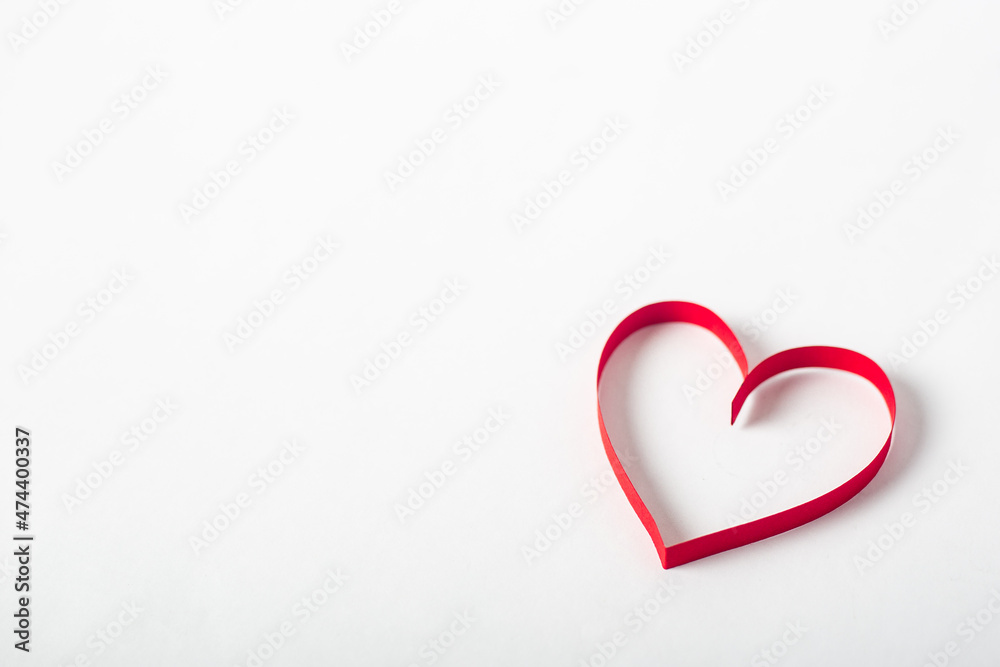 Red heart on a light white background. Composition Valentine's Day. Banner. Flat lay, top view Red heart on a light white background. Composition Valentine's Day. Banner. Flat lay, top view