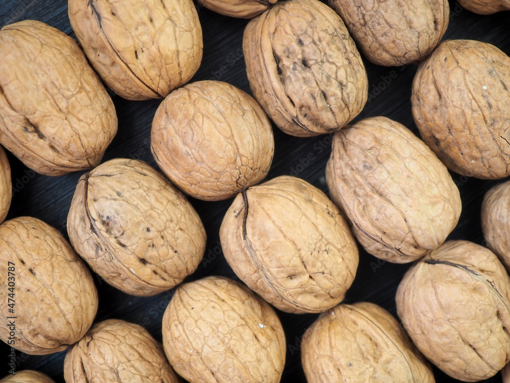 Fresh, whole walnuts close-up. Flat lay. Background Fresh, whole walnuts close-up. Flat lay. Background