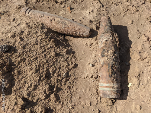 photo of rusty  unexploded gun shells as a war remenants photo