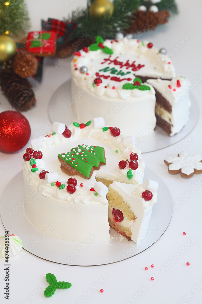 Celebration New Year Shortcake, decorated with gingerbread and fresh berries, on light background.
