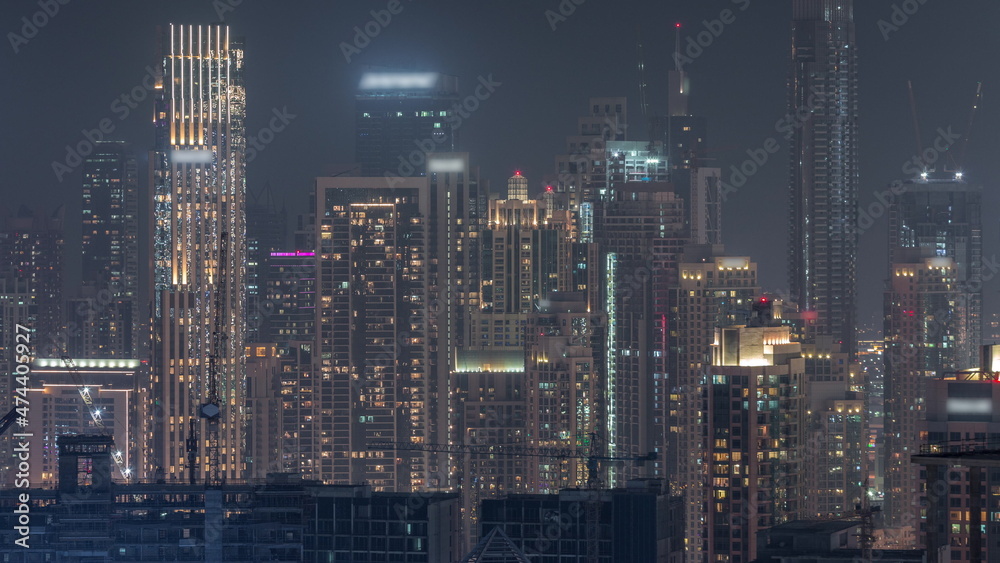 Panoramic skyline of Dubai with business bay and downtown district night timelapse. Panoramic skyline of Dubai with business bay and downtown district night timelapse.