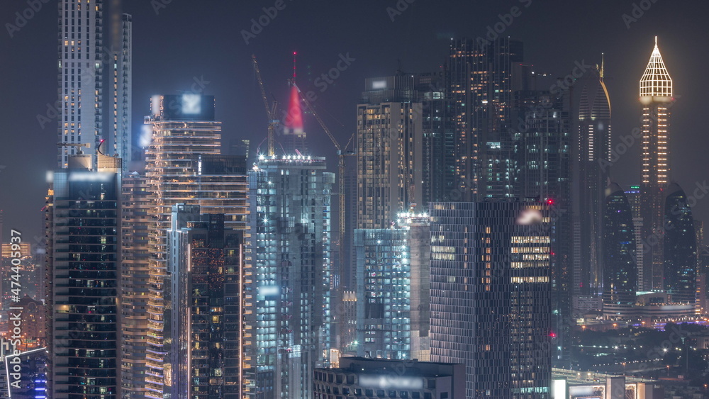 Rows of skyscrapers in financial district of Dubai aerial night timelapse. Rows of skyscrapers in financial district of Dubai aerial night timelapse.