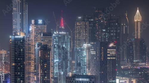 Rows of skyscrapers in financial district of Dubai aerial night timelapse. © neiezhmakov