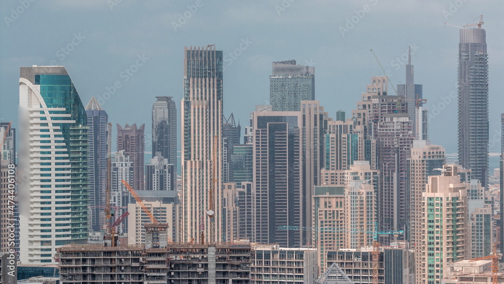 Panoramic skyline of Dubai with business bay and downtown district timelapse.