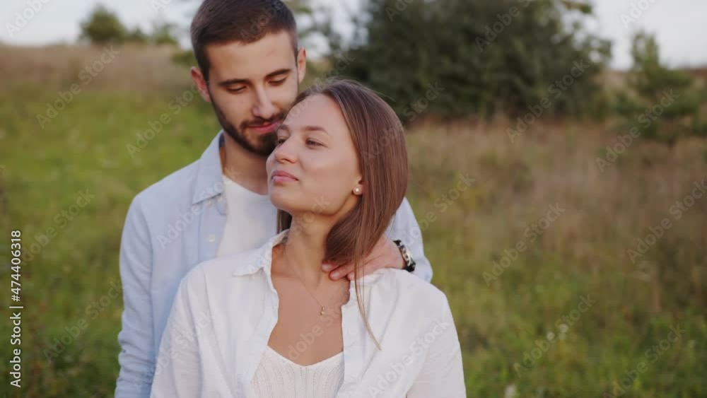Close-up of a beautiful girl and boy hugging in a park. Couple in love embracing tenderly and enjoying the moment. Close-up of a beautiful girl and boy hugging in a park. Couple in love embracing tenderly and enjoying the moment.