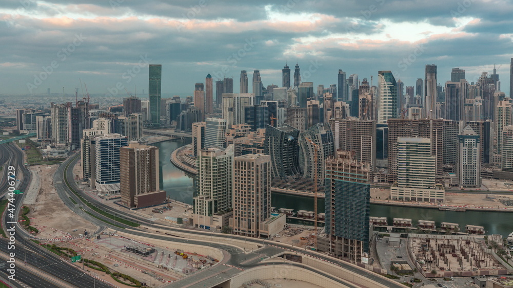 Skyline with modern architecture of Dubai business bay towers morning timelapse. Aerial view