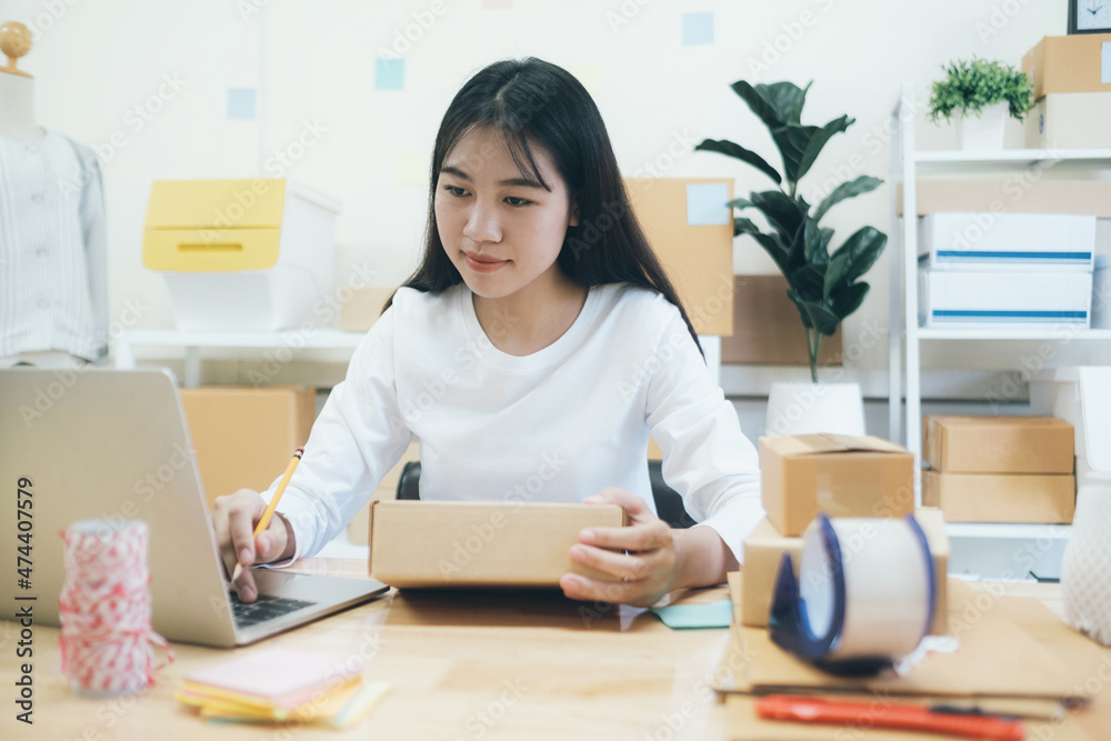 Online small business owner checking order. Online small business owner checking order.