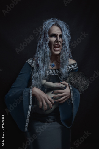 old woman witch with a child