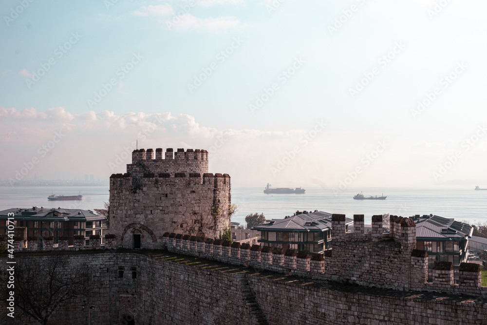 Yedikule, Istanbul, Turkey - December 2021: Thousands of years old Yedikule Fortress and Dungeons. Yedikule Fortress and Marmara Sea view. Selective focus.